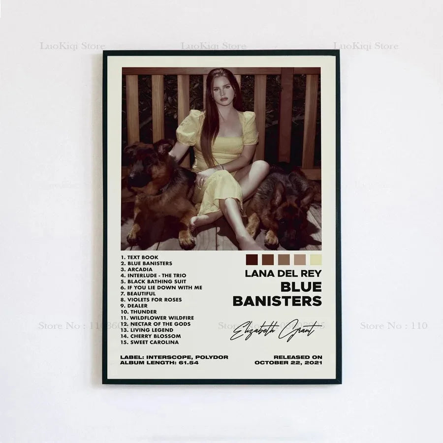A framed poster print of lana del rey in a yellow dress with dogs featuring the blue banisters album tracklist