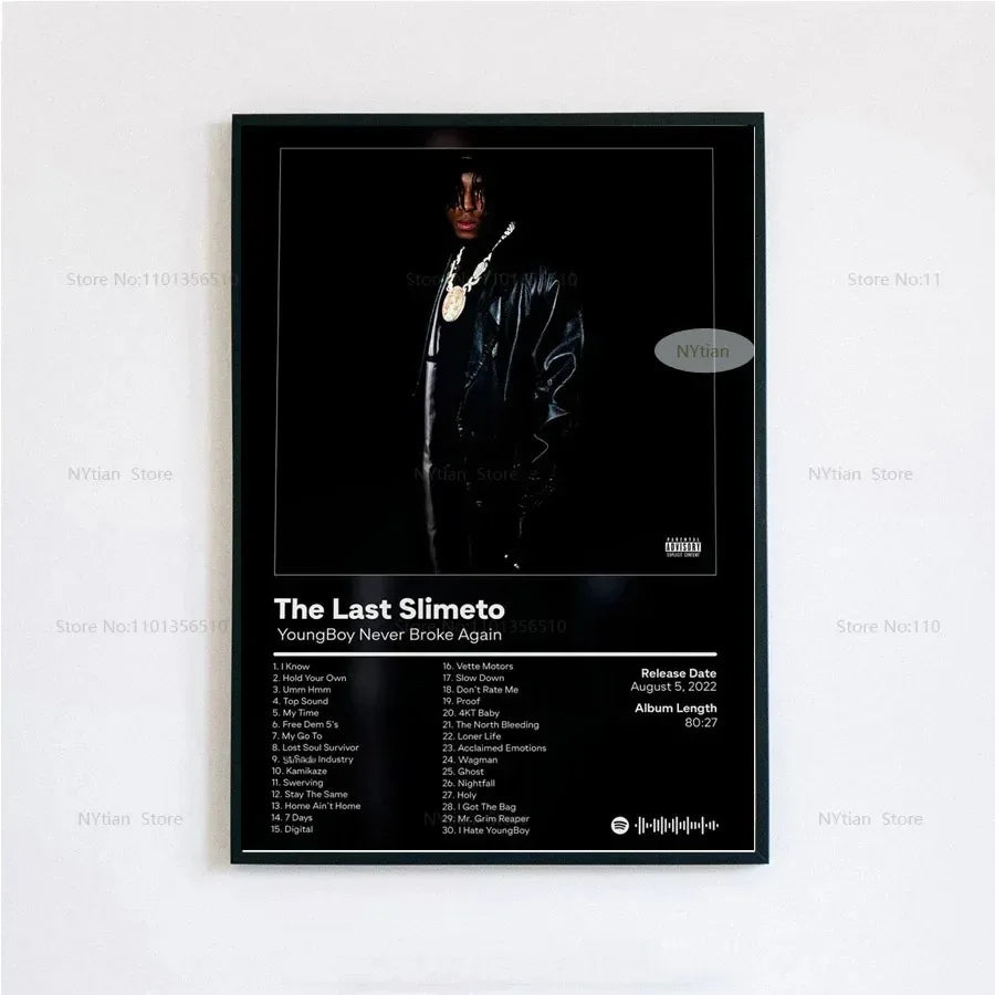 Black-framed poster print of youngboy never broke again in black leather jacket with gold chains and the last slimeto album cover