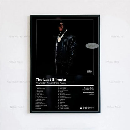 Black-framed poster print of youngboy never broke again in black leather jacket with gold chains and the last slimeto album cover