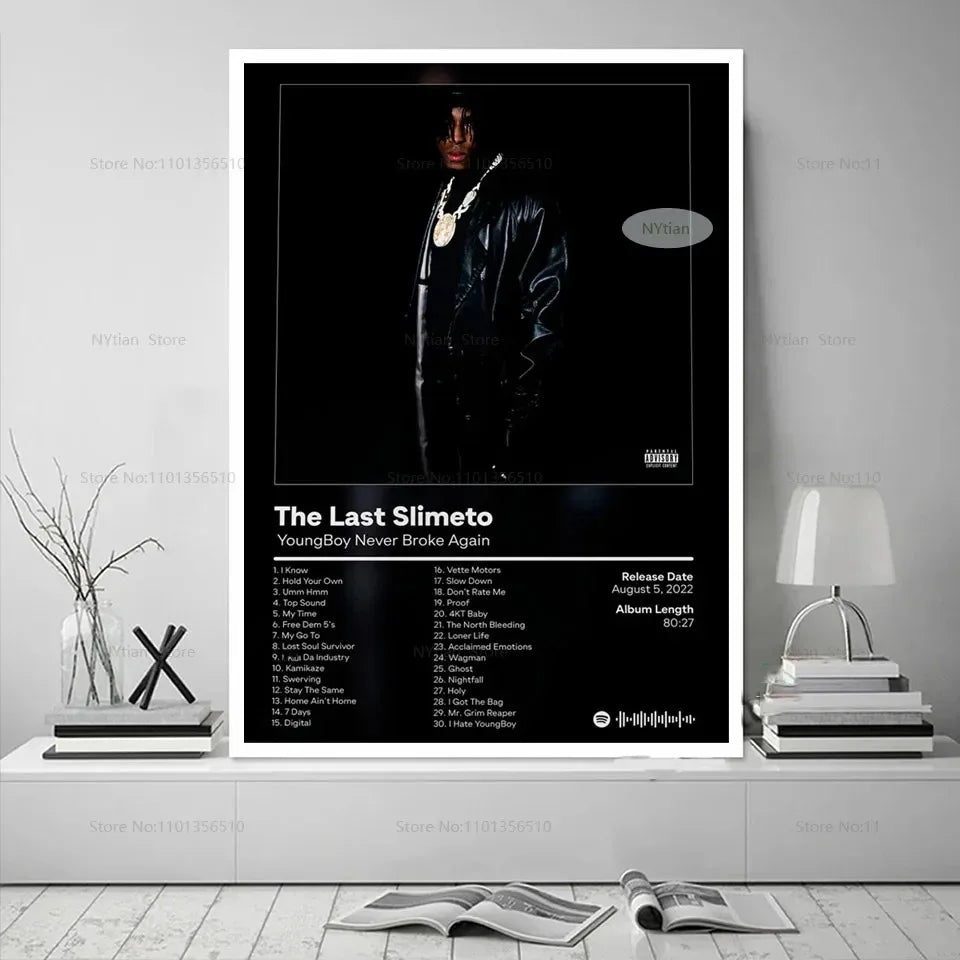 Black and white poster print featuring youngboy never broke again in glossy black leather jacket with gold chains promoting last slimeto album