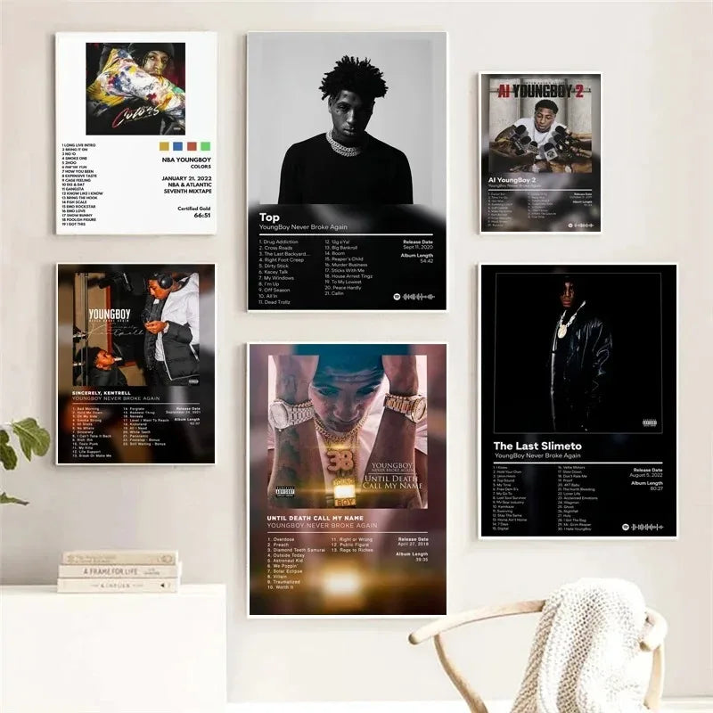 Collection of six framed nba youngboy poster prints featuring album art and tracklists with varied color and gold accents