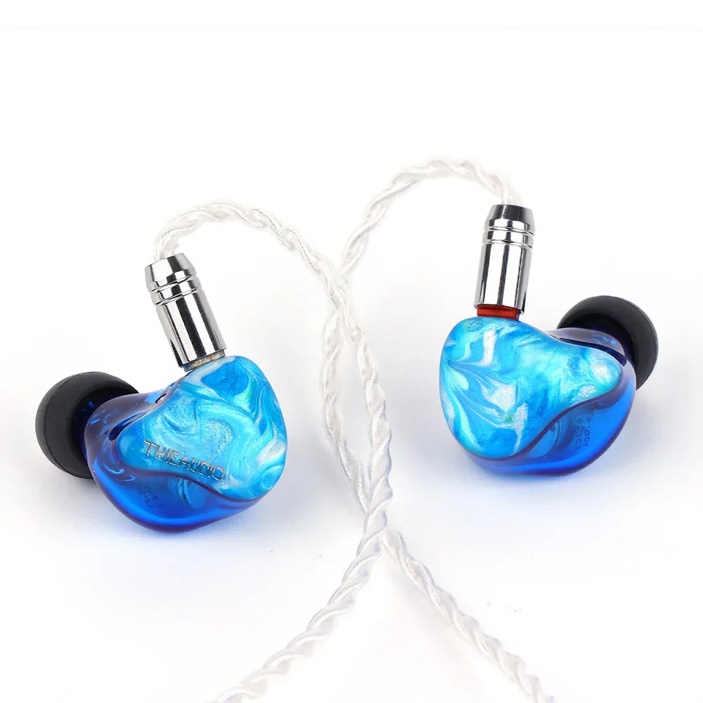 Blue marbled resin thieaudio legacy 2 hybrid in-ear monitor with silver connectors and black silicone tips for audiophiles musicians