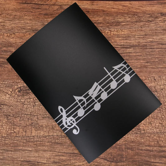 Black matte premium piano sheet music clip with silver musical staff tri-fold design six-page capacity for musicians
