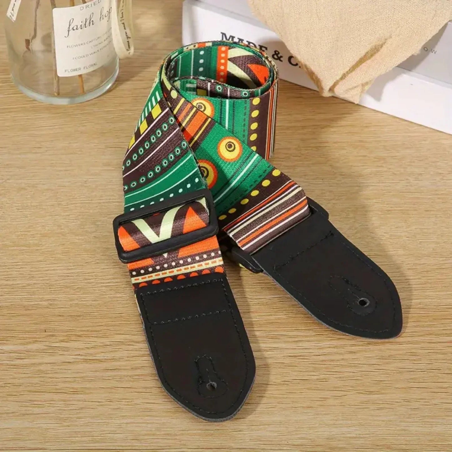 Premium woodgrain leather guitar strap in vibrant green orange and brown pattern with black leather ends fits classical electric guitars