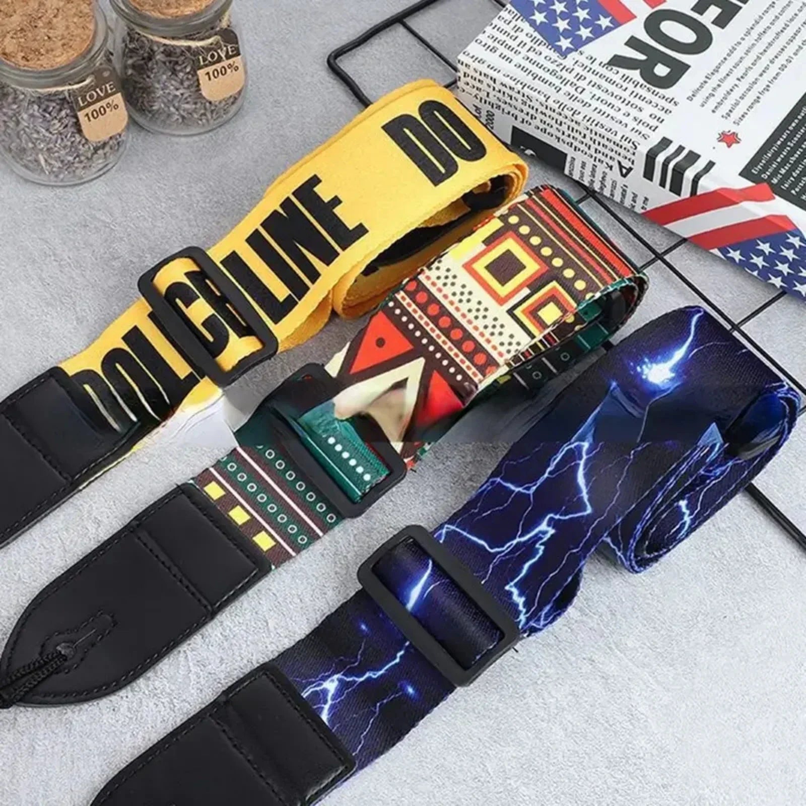 Yellow leather guitar strap with bold black do line lettering and black buckle fits classical electric guitars