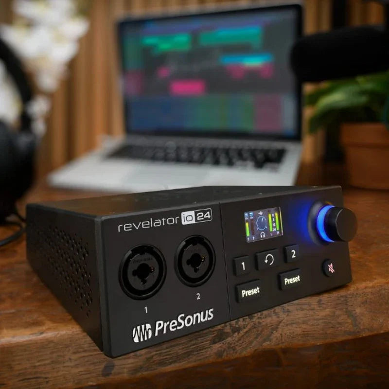 Black presonus revelator io24 usb sound card with illuminated blue led display and knobs for live recording controller use