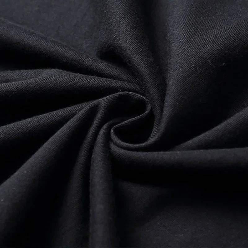 Black soft textured fabric with subtle ribbed weave on a producer artist production beat maker music t shirt