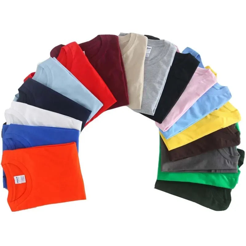 A vibrant array of folded cotton producer artist production beat maker music t shirts in assorted solid colors displayed