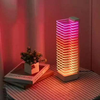 A modern product manufacturer desk tower voice control led lamp with pink and orange neon light strands in a white frame