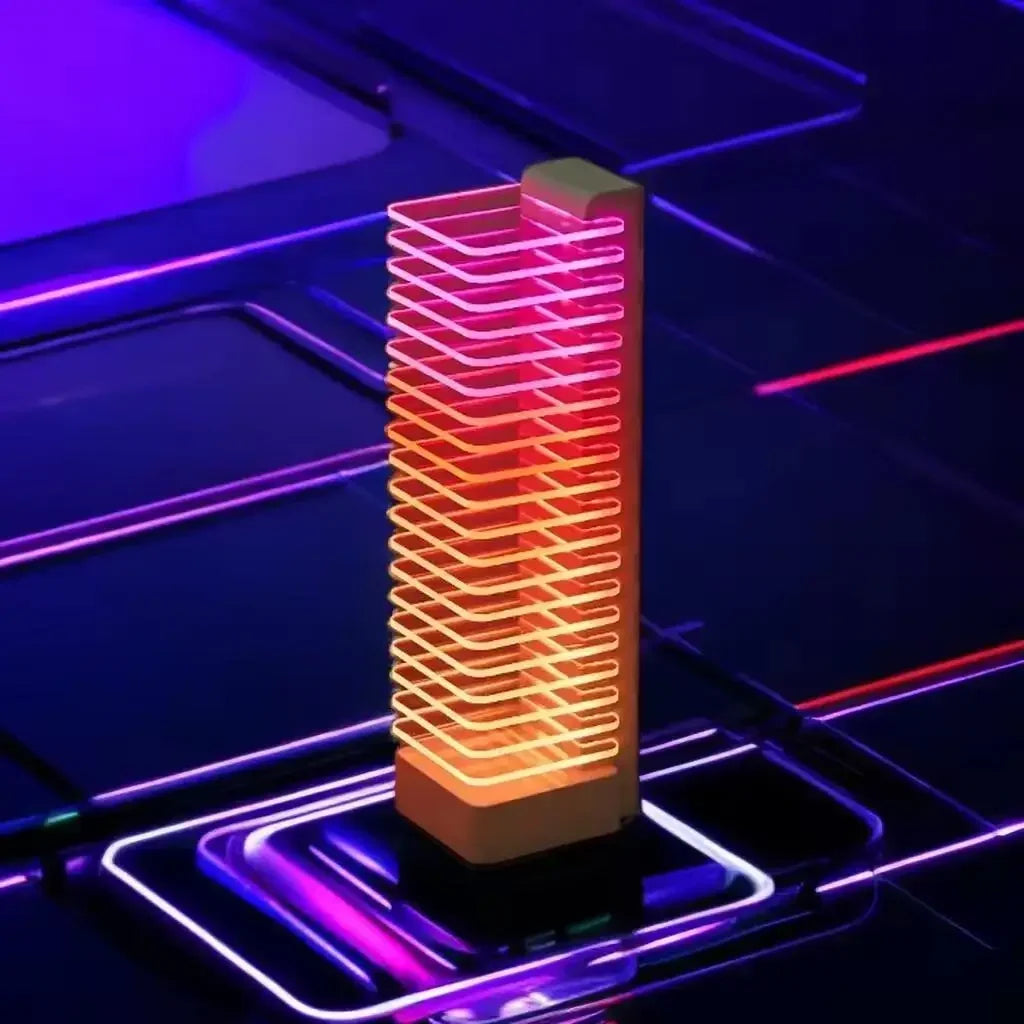 A sleek tower voice control led lamp with layered translucent panels and warm pink to orange gradient glow for desk use