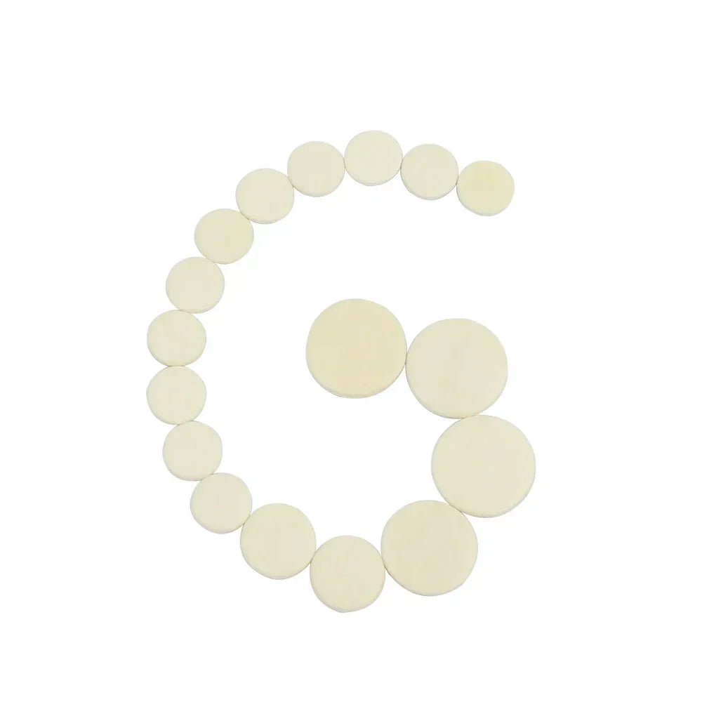 Off-white circular foam pads arranged in a curved pattern for bb clarinet accessories reed box cleaning brushes trimmer use