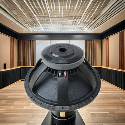 Black robust professional 18-inch powered subwoofer speaker with matte finish and visible internal components for pro audio use