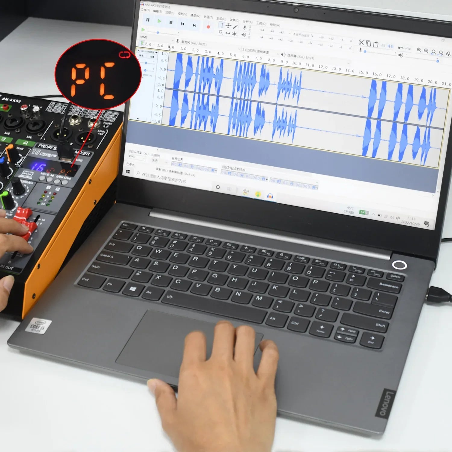Gray lenovo laptop displaying console lomeho am-aks2 with uhf wireless microphone and +48v phantom power audio mixer software