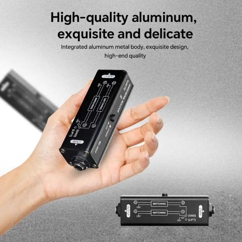 Black aluminum ground looping isolator audio splitter with labeled input and output ports for isolator noise elimination