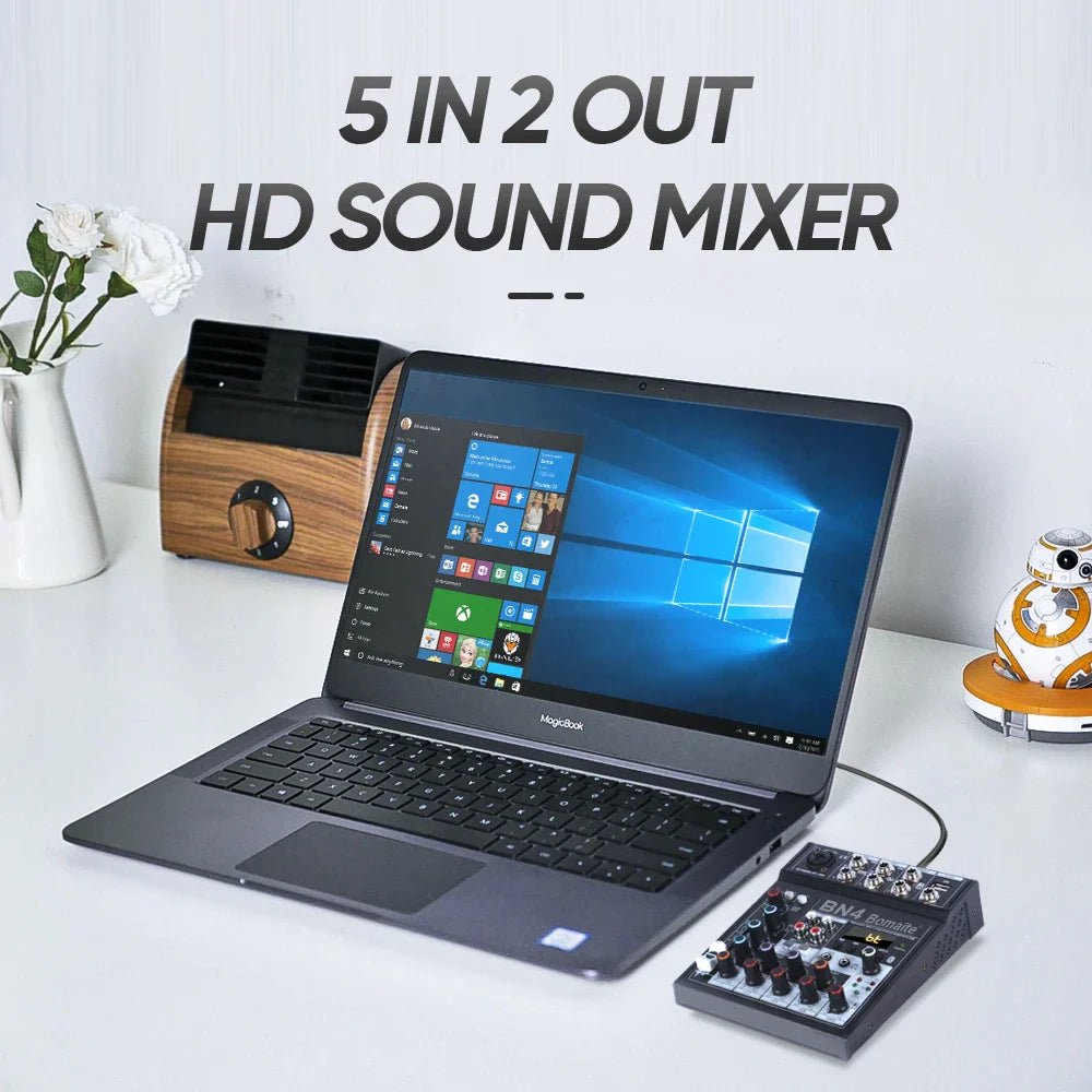 Black and silver professional audio mixer with 48v phantom power usb computer mp3 input and multiple knobs and ports