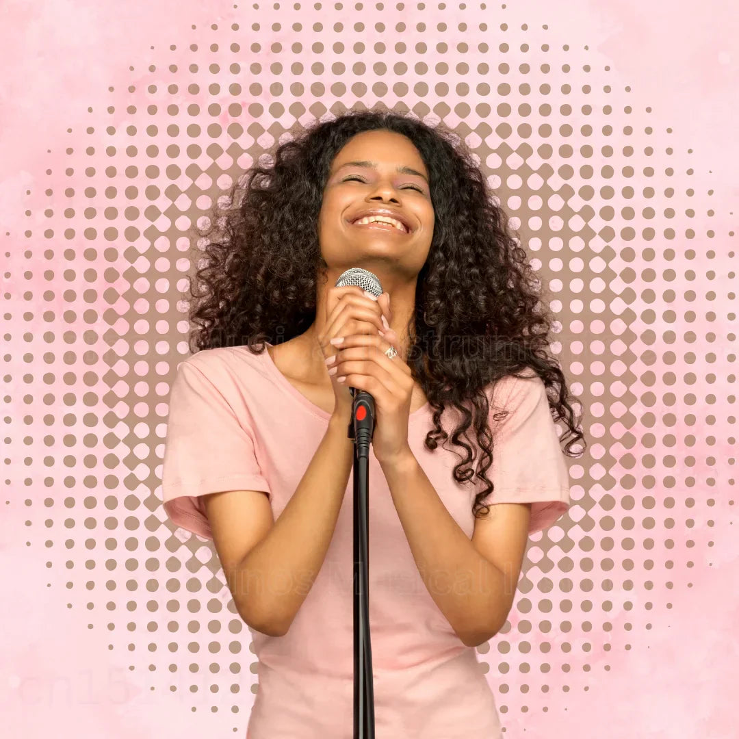 A professional bling pink karaoke microphone with a silver mesh grille black handle red accent and metal body for singing