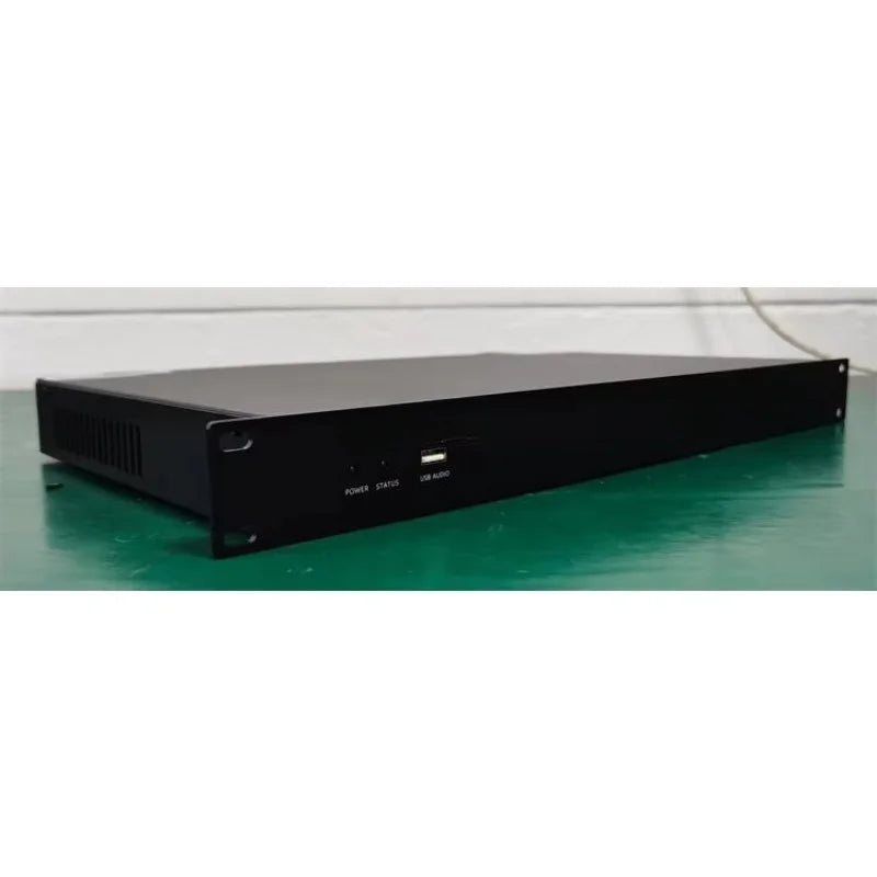 Black rectangular rack-mountable professional digital audio processor with usb ports and ventilation for conference speaker management
