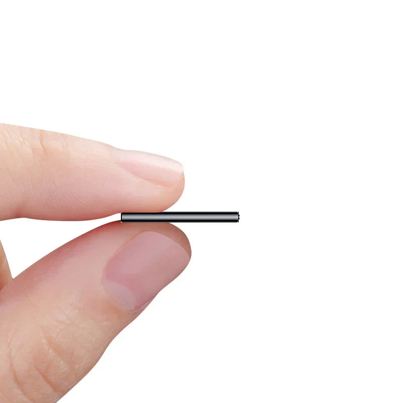 A sleek black cylindrical metal spacer held between fingers for professional dictaphone ultra with long distance encryption and voice activated audio recording
