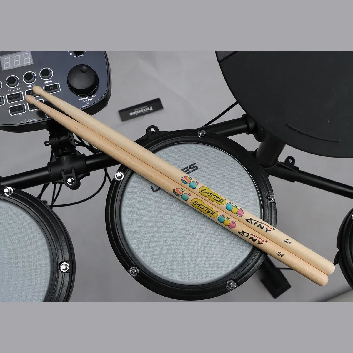 A pair of light-colored professional drum stick 5a walnut wood with colorful easter-themed graphics by kiny