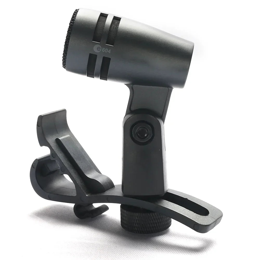 Black condenser professional mic music with matte finish and three ventilation slots on adjustable clip stand for drums