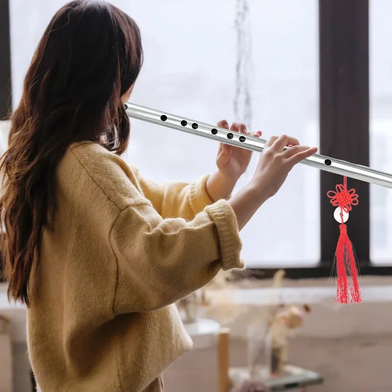 Professional stainless steel flute with black finger holes and red chinese knot tassel for music learners beginners mildew resistant easy play