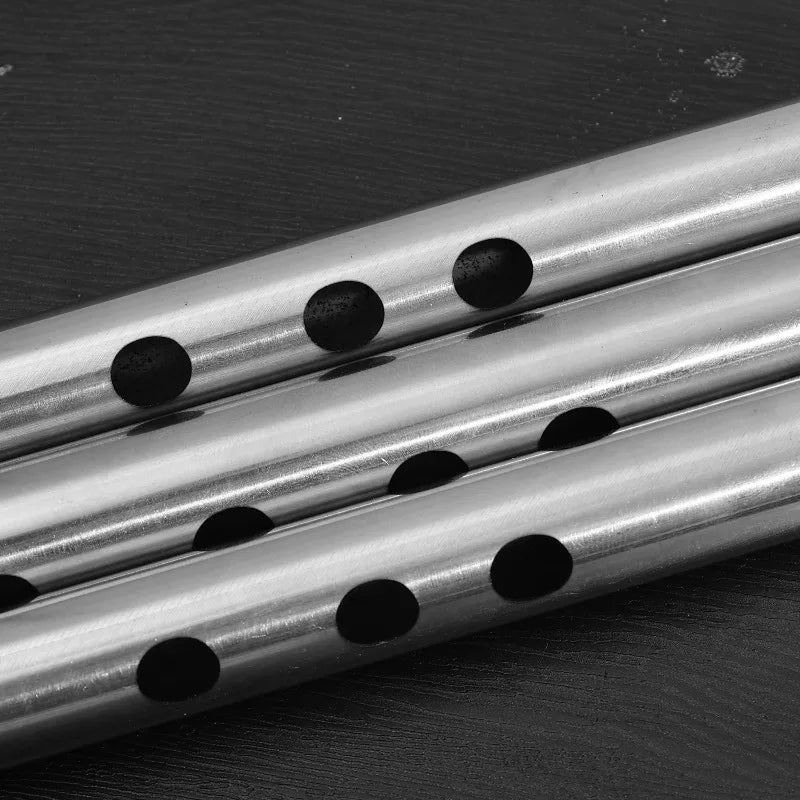 Three parallel metallic silver stainless steel flute rods with evenly spaced holes for music learners beginners mildew resistant easy play
