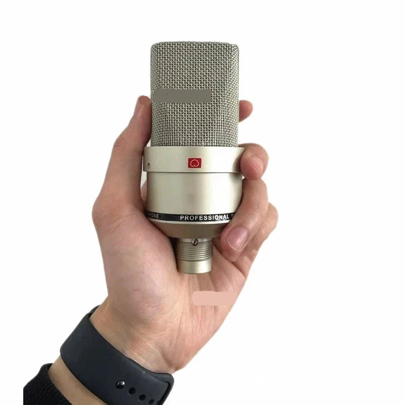 A sleek silver professional studio condenser microphone with mesh grille and red logo for laptop mic singing and karaoke streaming wired use