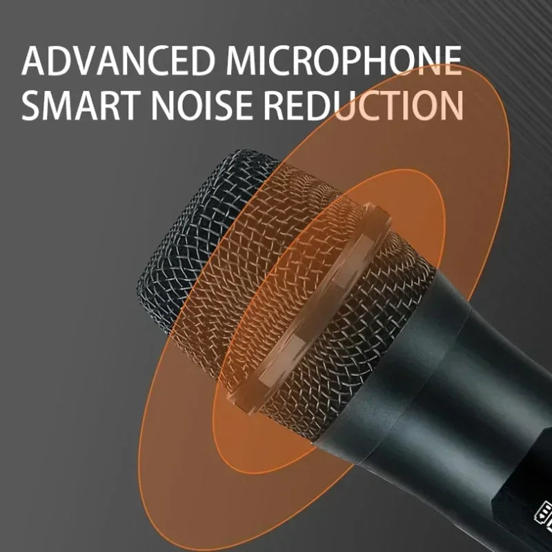 Black handheld microphone with mesh grille and orange accents featuring smart noise reduction for professional vhf wireless use