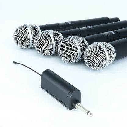 Set of four black professional wireless microphone channels karaoke handheld with silver mesh grilles and black receiver unit