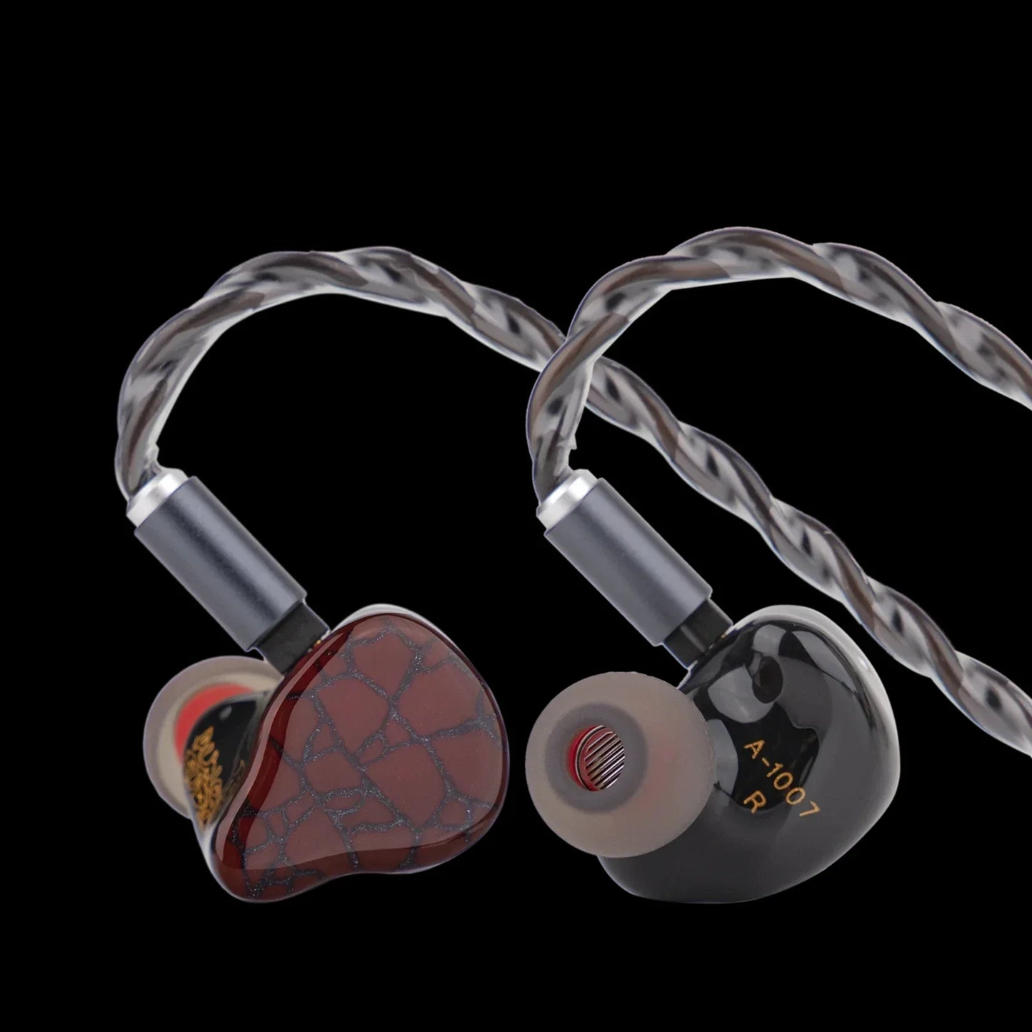 A pair of punch audio martilo iem with planar drivers featuring red cracked glass and matte black earpieces and custom interchangeable cable