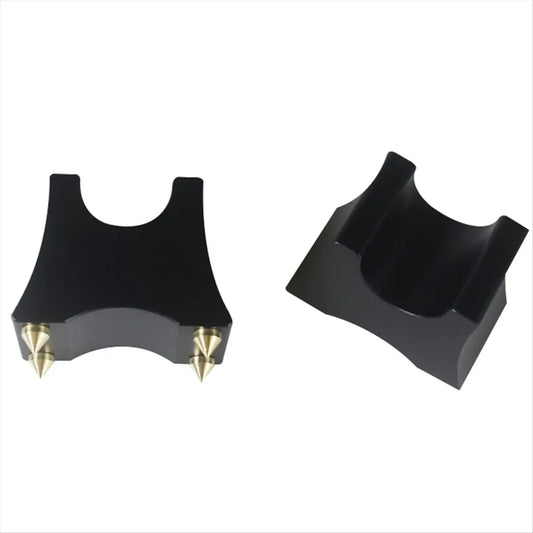 Black plastic motorcycle handlebar clamp with gold metal spikes used as rack bracket holder for hi-fi audio cable support stand vibration-isolating