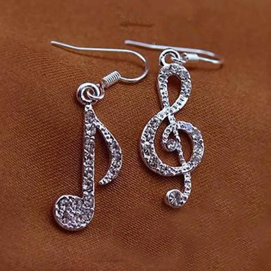 Silver punk fashion earrings with sparkling rhinestones shaped like musical notes and asymmetrical lady earrings