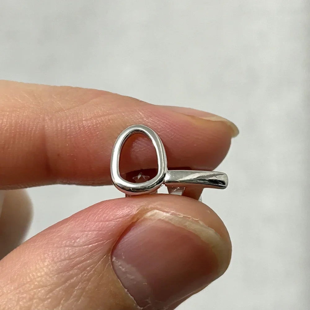 Silver key-shaped ring with polished minimalist design featured in RACHELZ hip hop silver teeth grillz collection