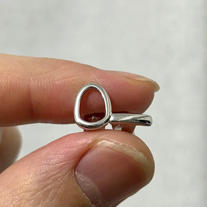 Silver key-shaped ring with polished minimalist design featured in RACHELZ hip hop silver teeth grillz collection