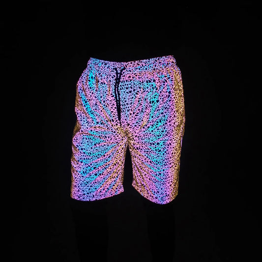 Vibrant neon-patterned rainbow color hip hop reflective swim trunks with glowing pink blue and gold geometric design for men