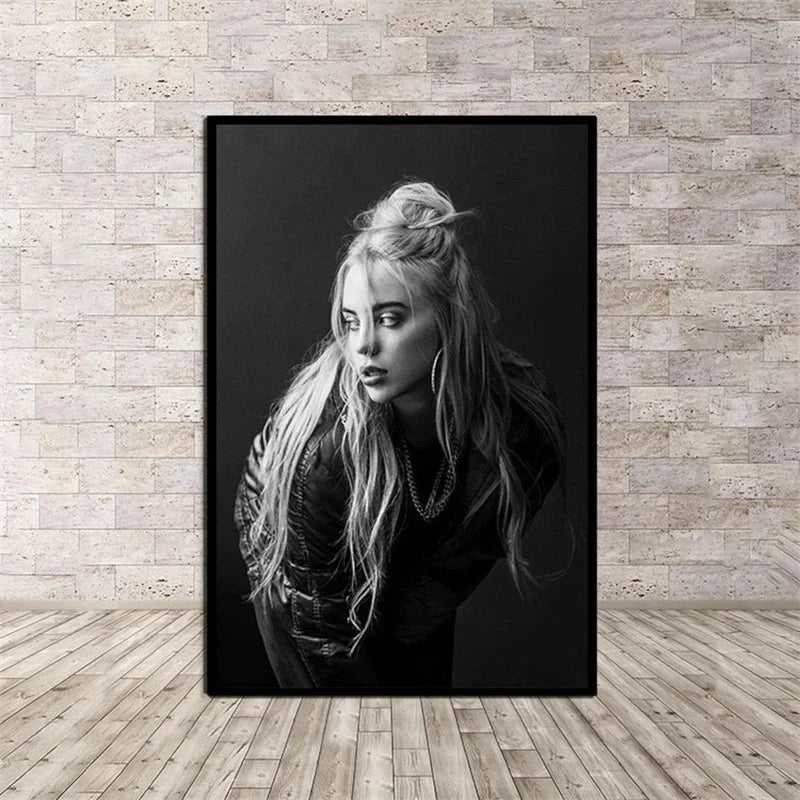 Black-framed black-and-white canvas wall art of a blonde woman with layered necklaces for rap music room decor