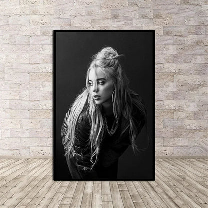 Black-framed black-and-white canvas wall art of a blonde woman with layered necklaces for rap music room decor