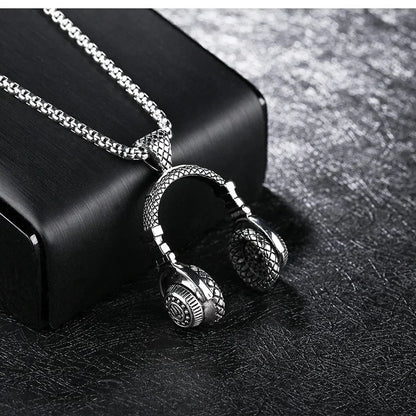 Silver-toned stainless steel music headphone pendant necklace with intricate detailing and long chain hiphop style