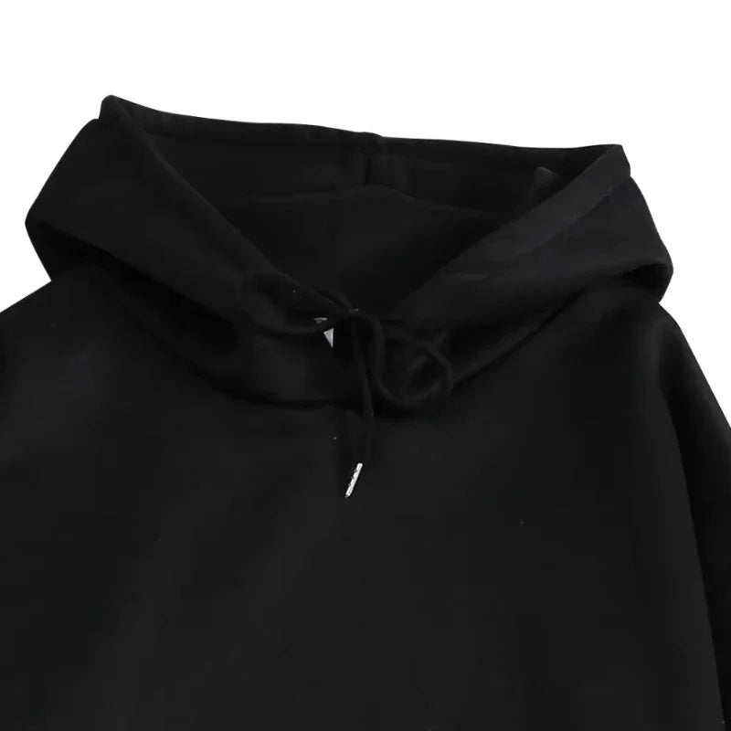 Black hooded sweatshirt with drawstring and subtle white tag detail from rapper Anuel AA 2023 oversized streetwear collection
