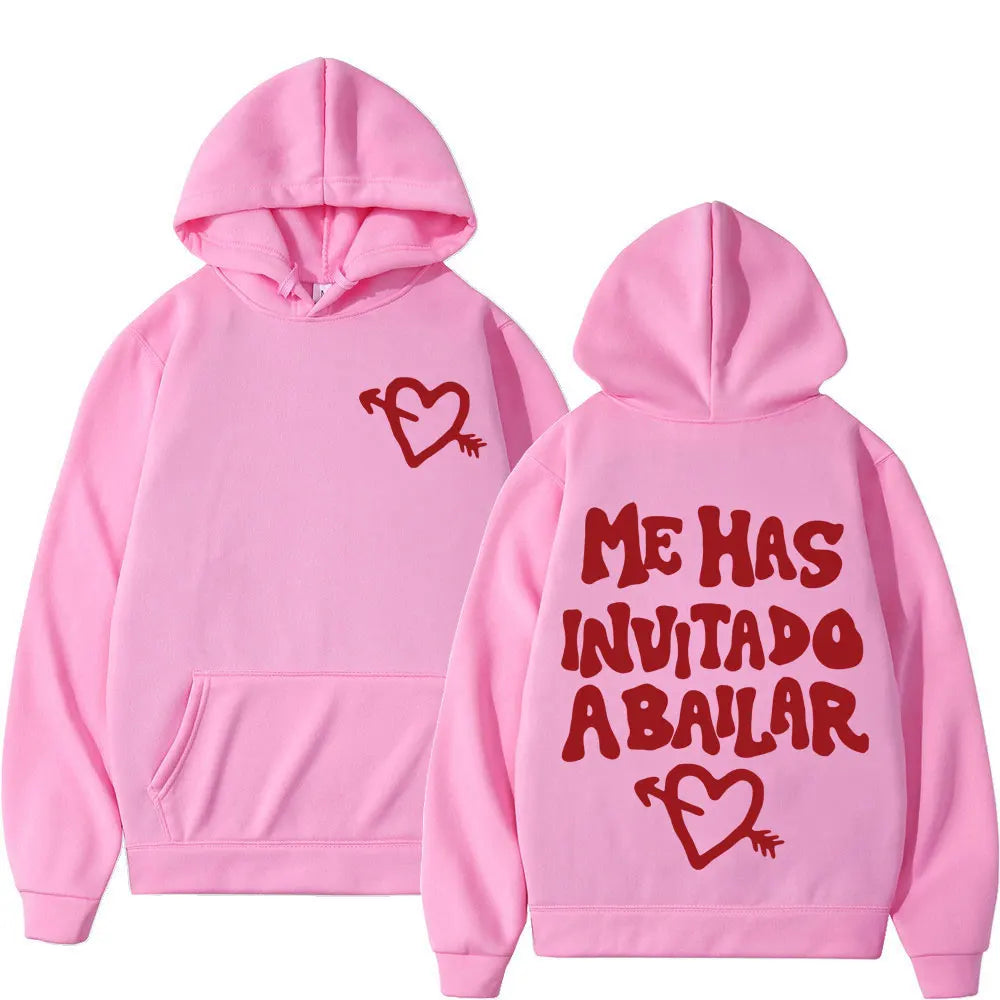 Pink hoodie with red heart and arrow graphic front and bold me has invitado a bailar text on back by rapper dani fernandez punk sportswear autumn