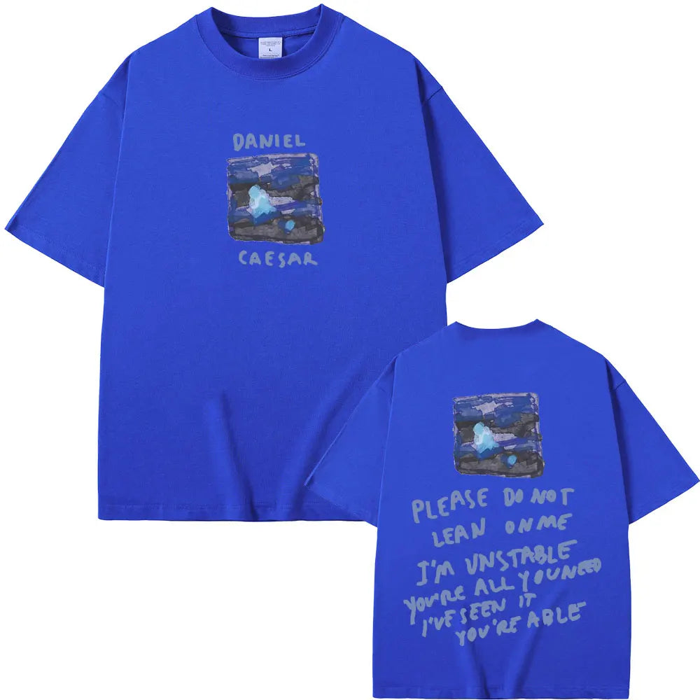 Royal blue oversized t-shirt featuring rapper Daniel Caesar graphic and back lyrics for women hip hop fashion streetwear