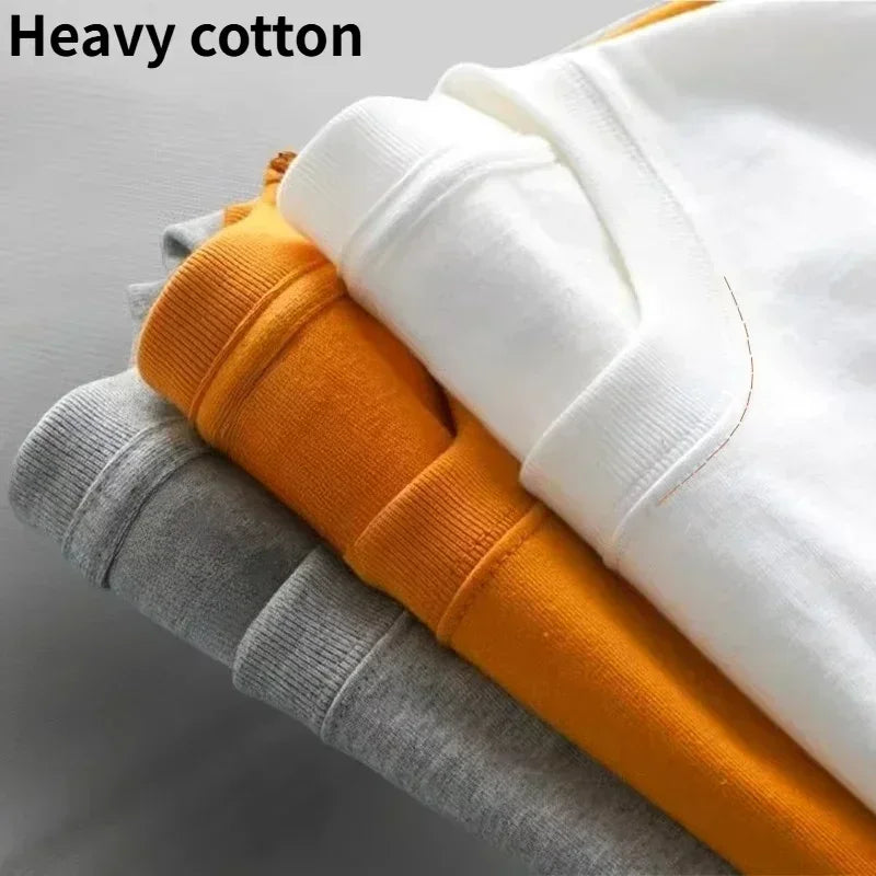 Stacked cotton sweatshirts in gray orange and white featuring rapper eminem album stans print for hip hop vintage style