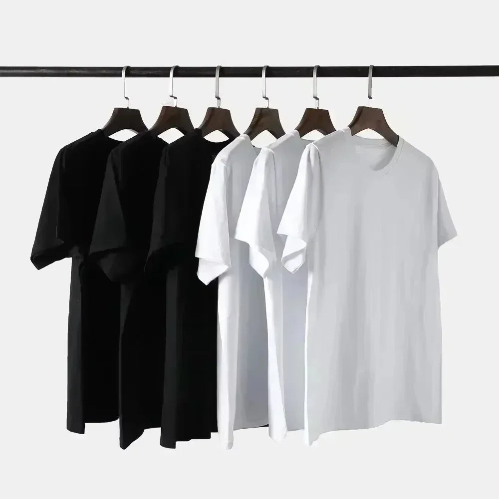 Six black and white oversized cotton t-shirts with rapper Eminem 2025 album stans print in hip hop vintage style hanging