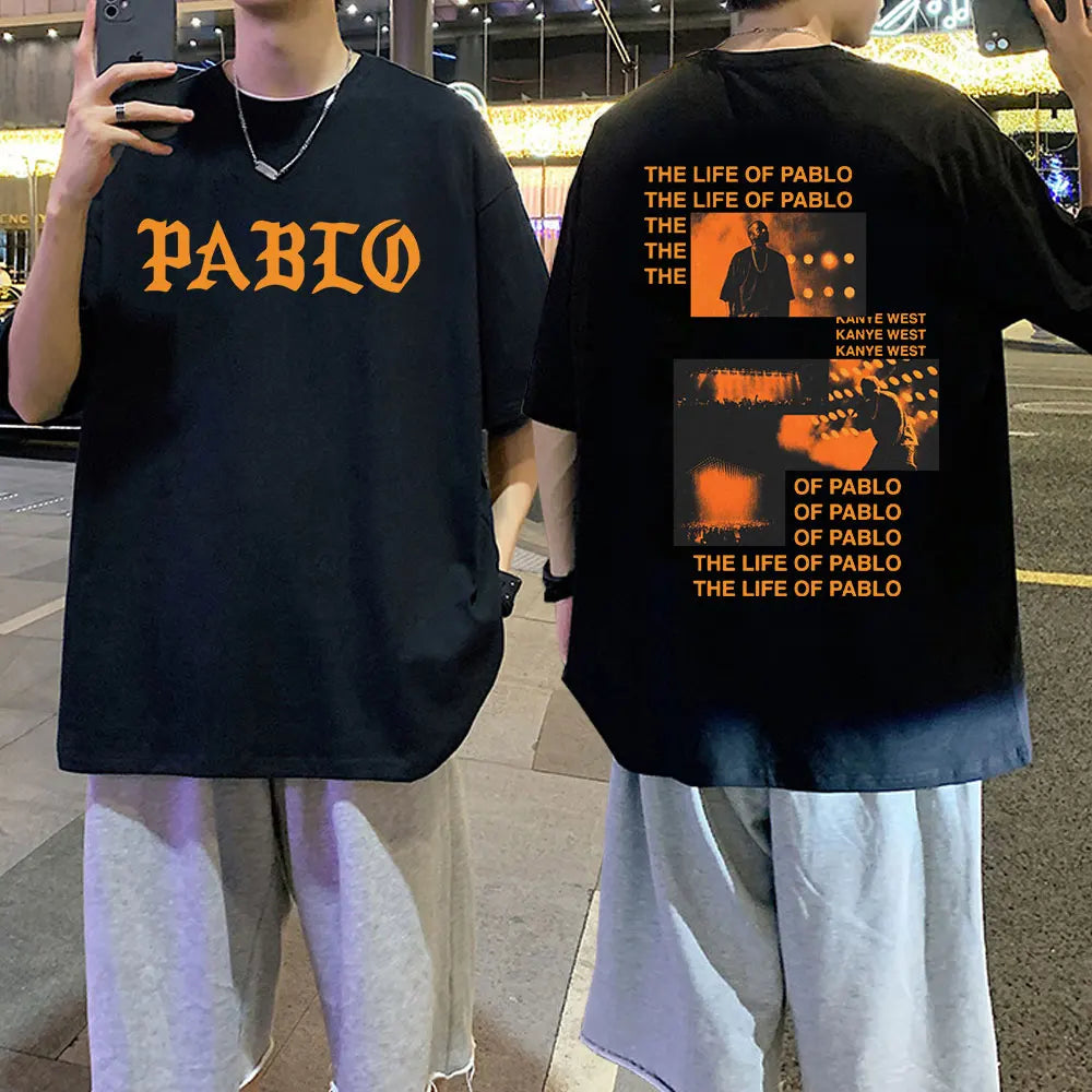 Black oversized cotton t shirt with orange pablo lettering front and kanye west album graphic print back hip hop fashion