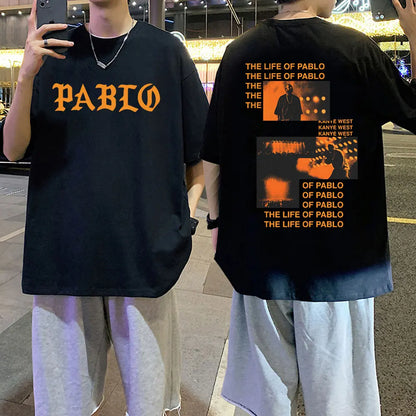 Black oversized cotton t shirt with orange pablo lettering front and kanye west album graphic print back hip hop fashion