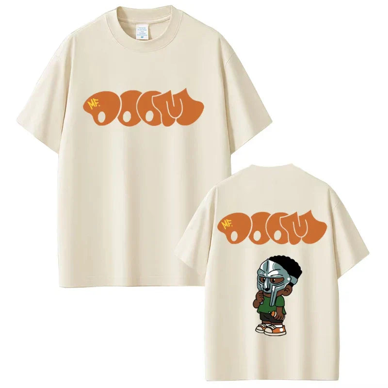 Cream-colored cotton t-shirt with bold orange rapper mf doom logo and cartoon helmet illustration on the back for hip hop fashion