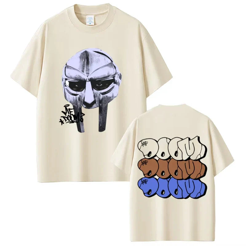 Cream-colored cotton t-shirt featuring rapper mf doom mask front and doom album madvillainy lettering back hip hop fashion