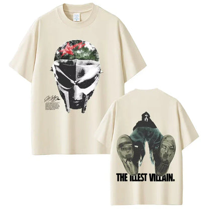 Cream-colored short sleeve cotton t-shirt featuring rapper mf doom helmet graphic front and jeans figure print on back in hip hop fashion