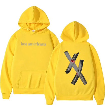Bright yellow rapper mgk lost americana tour 2026 hoodie with gray text front and vintage hip hop x cigar graphic back sleeve oversized y2k style