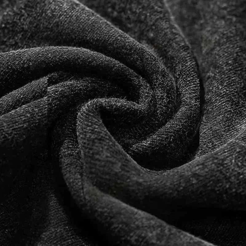 A soft dark gray knit fabric close-up of the mgk lost americana vintage washed hip hop short sleeve t-shirt
